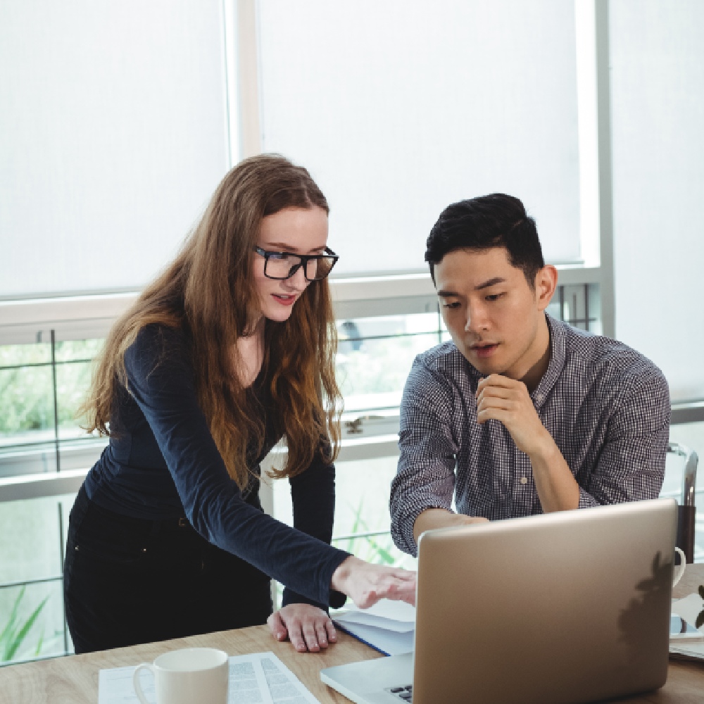 business-executives-discussing-laptop